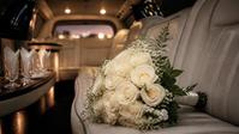 Wedding bouquet on limousine seat